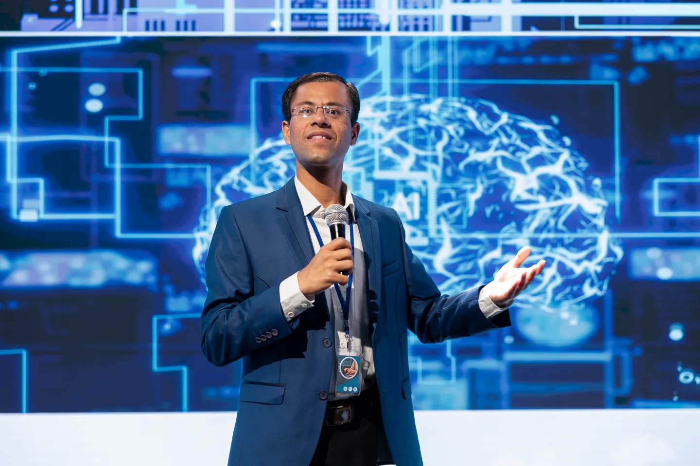 A presenter discussing technology on stage